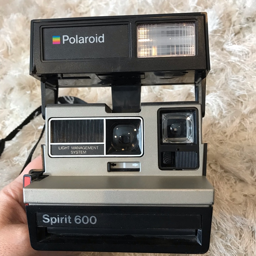 Polaroid Spirit 600 instant camera with neck strap
